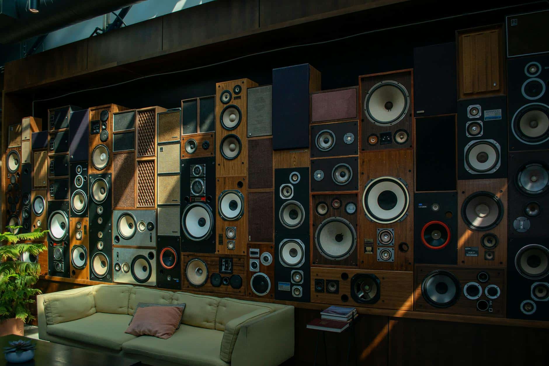 wall of vintage speakers in modern living room